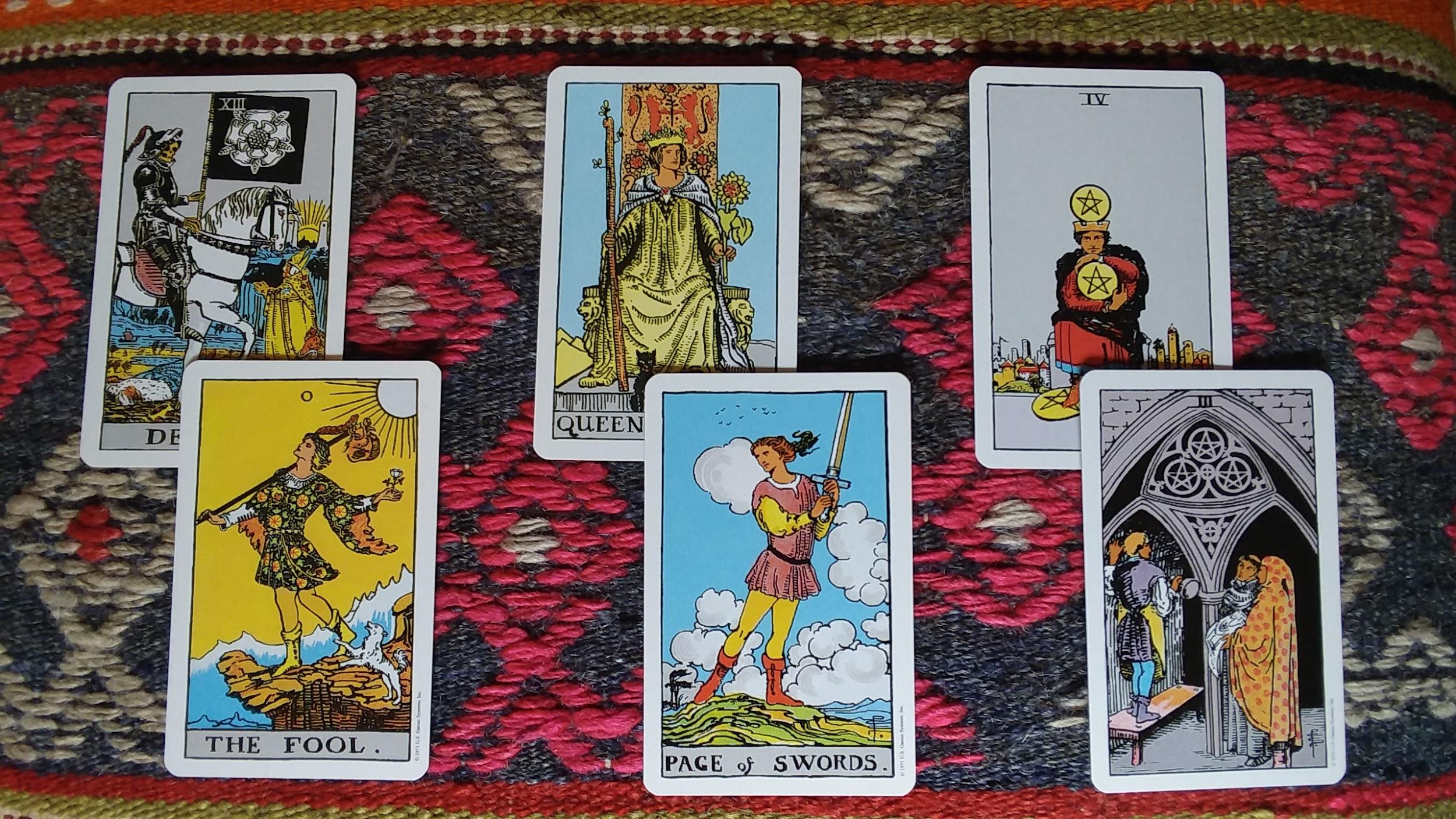 six tarot cards paired up in a spread