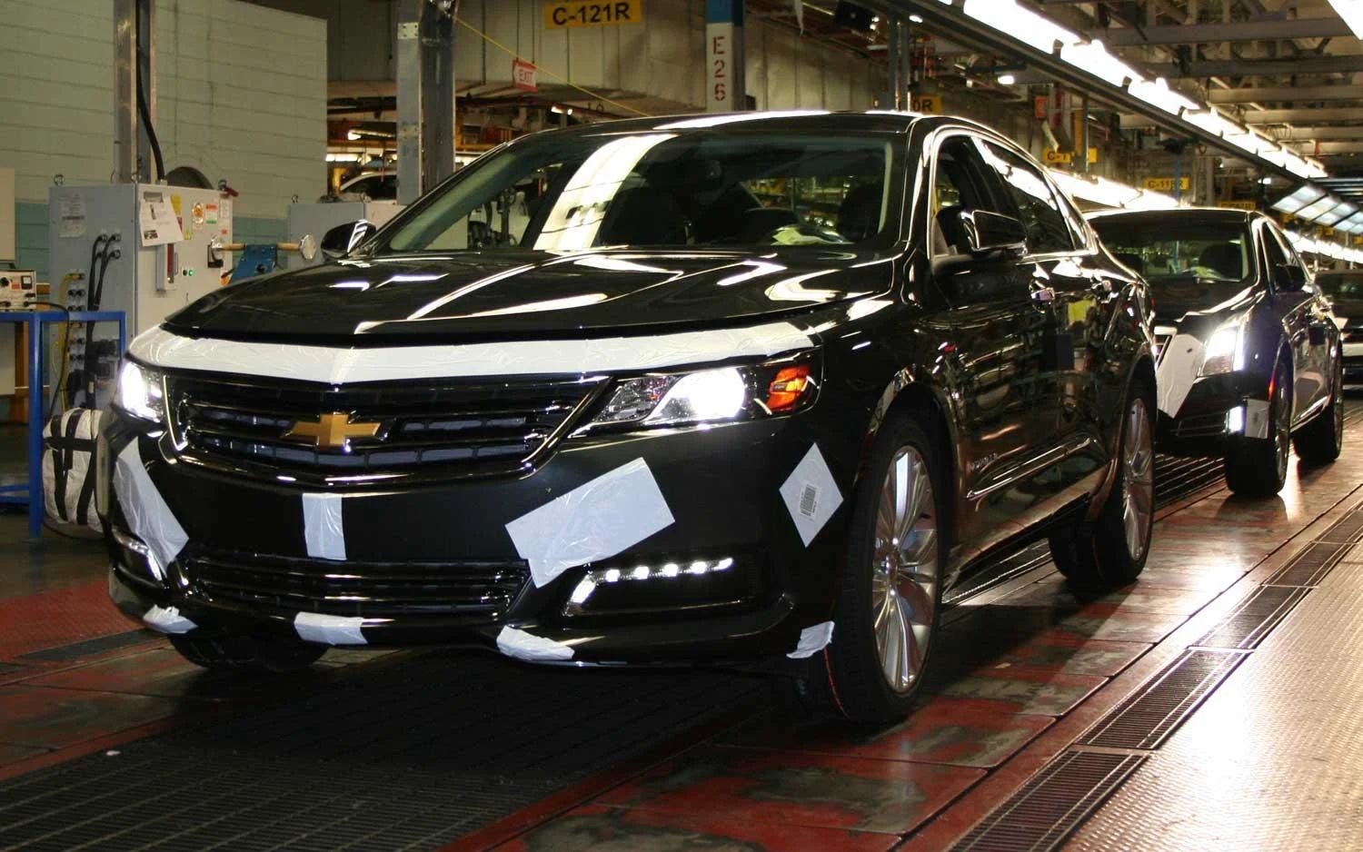 Black Chevrolet Impala on a factory assembly line