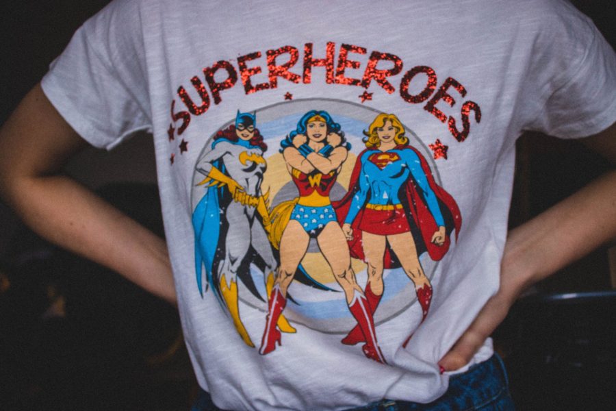 Person wearing superheroes printed t shirt: how to make money online from print on demand (ways & steps)