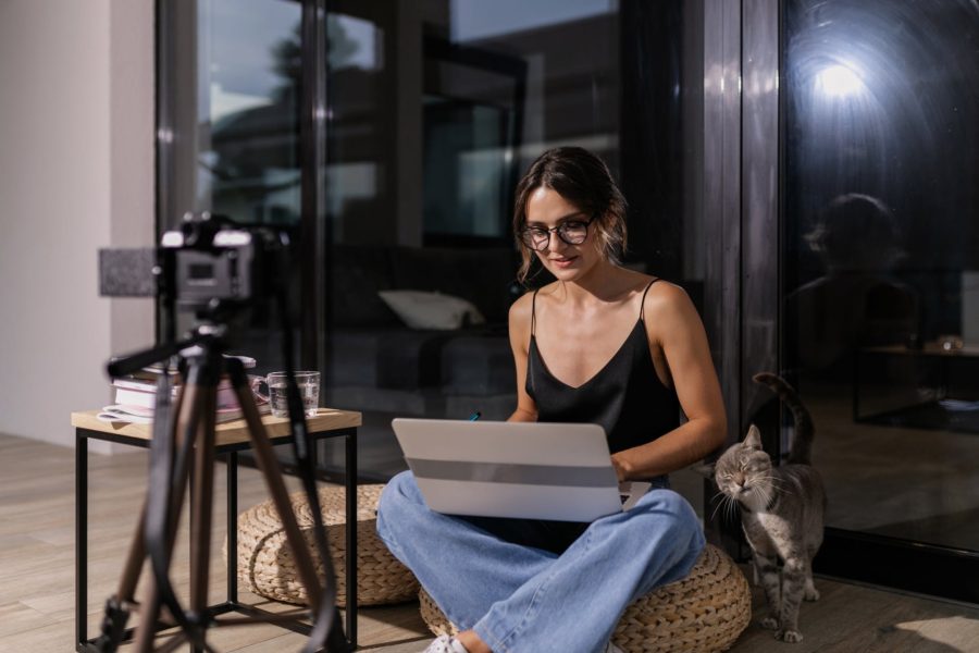 2. Build an Online Presence as musician - pic: a woman in black spaghetti strap top using laptop