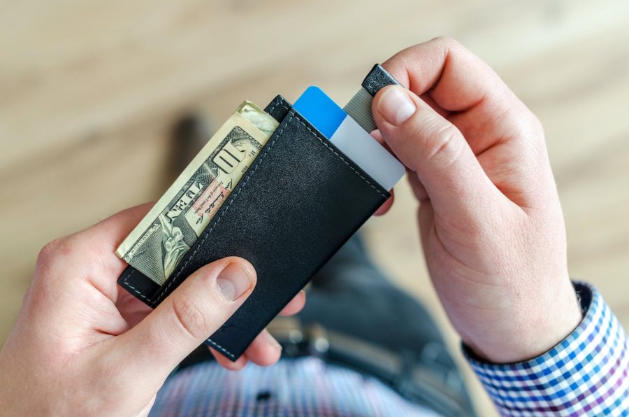 Personal Finance Niches - pic: person holding black card holder