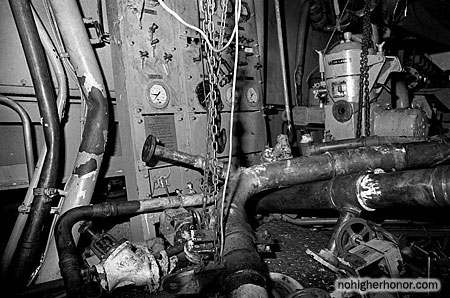 A view of an auxiliary machinery room on the guided missile frigate USS SAMUEL B. ROBERTS (FFG-58) damaged when the ship struck a mine while on patrol in the Persian Gulf on April 14, 1988. Photo taken 3 May 1988. The ship was in dry dock undergoing temporary repairs.