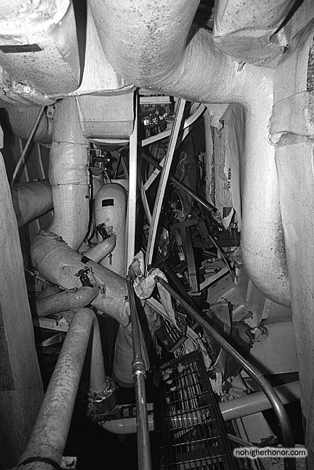 A view of an auxiliary machinery room on the guided missile frigate USS SAMUEL B. ROBERTS (FFG-58) damaged when the ship struck a mine while on patrol in the Persian Gulf on April 14, 1988. Photo taken 3 May 1988. The ship was in dry dock undergoing temporary repairs.