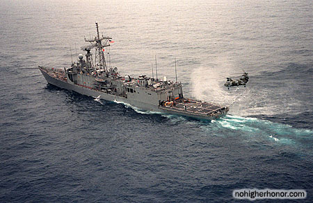 A port quarter view of the guided missile frigate USS SAMUEL B. ROBERTS (FFG-58) under tow by the tug Hunter after the ship struck a mine on Apr. 14, 1988.
