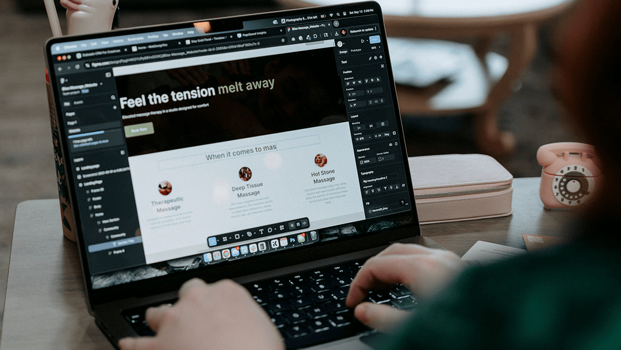 Over the shoulder view of a woman using Figma for web design layouts with WebDesignToo