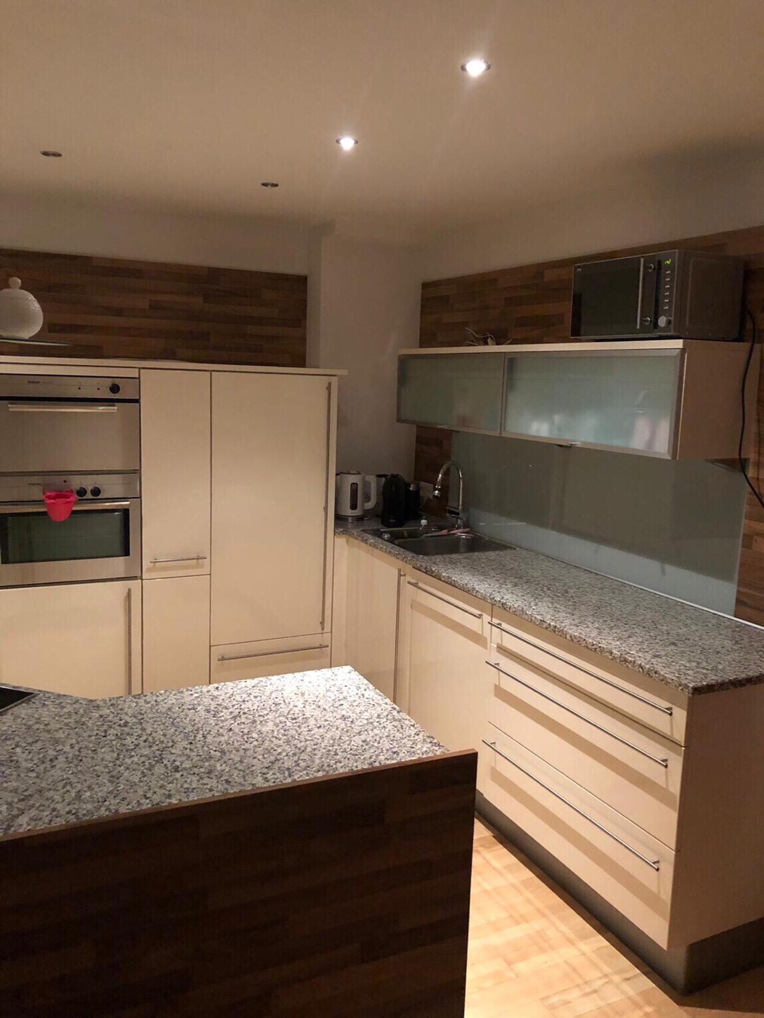 Black Kitchen Cabinet With Marble Kitchen Island Nolte Kuechen Com