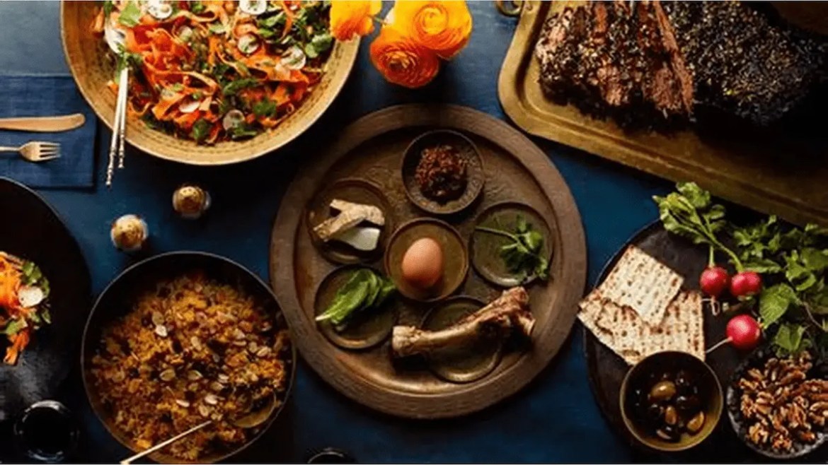 Rustic table spread featuring reconstructed ancient dishes including Mesopotamian lamb stew, Egyptian bread, Aztec xocolatl, and African fufu.