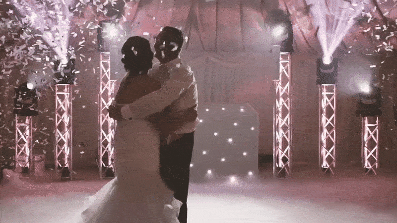 Eco-friendly confetti falling over a wedding dance floor