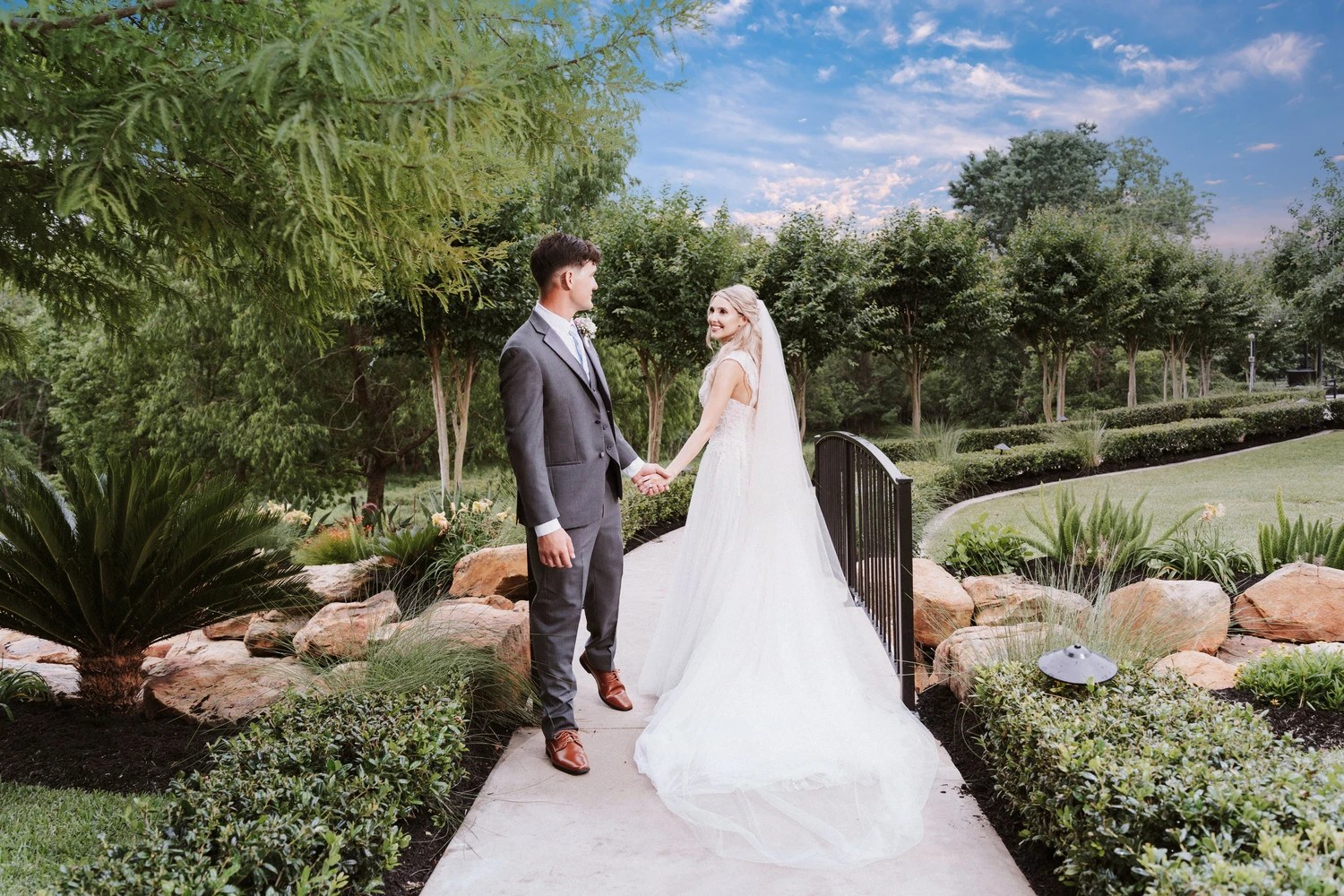 Bride and groom walking through send-off, see how we choose your staff