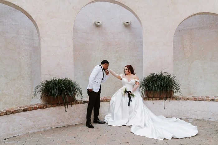 Bride and groom in the courtyard at The Bell Tower on 34th, Houston, TX