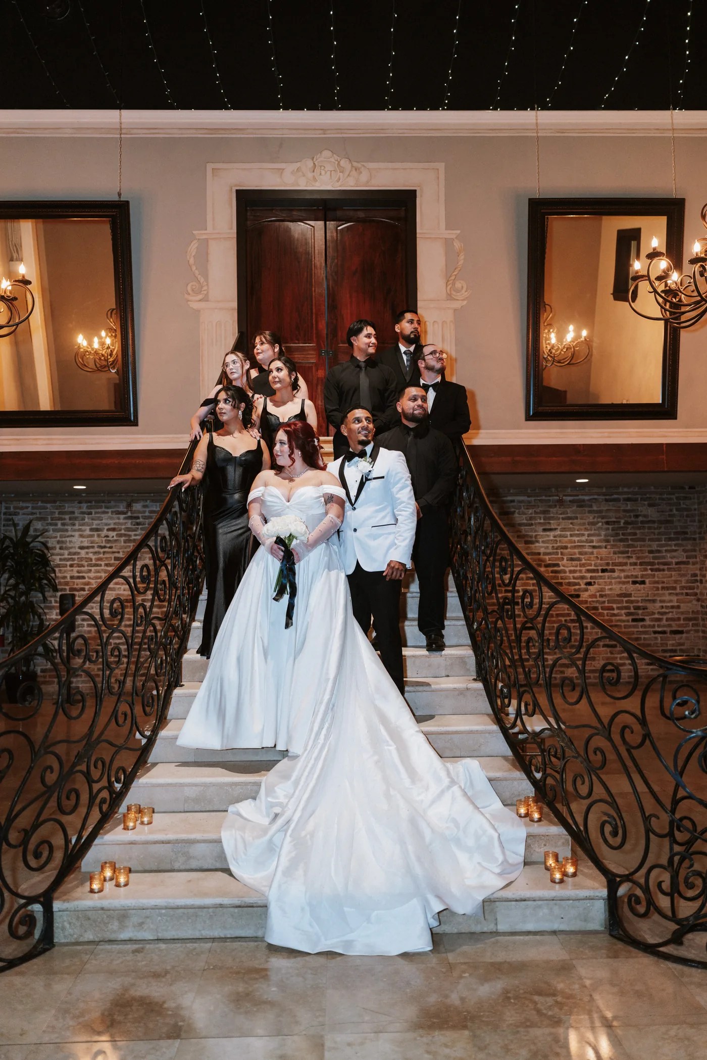 Bride and groom on the grand staircase at The Bell Tower on 34th, Houston, TX