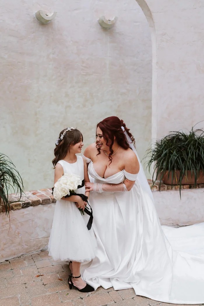 Bride with flower girl at The Bell Tower on 34th, Houston, TX