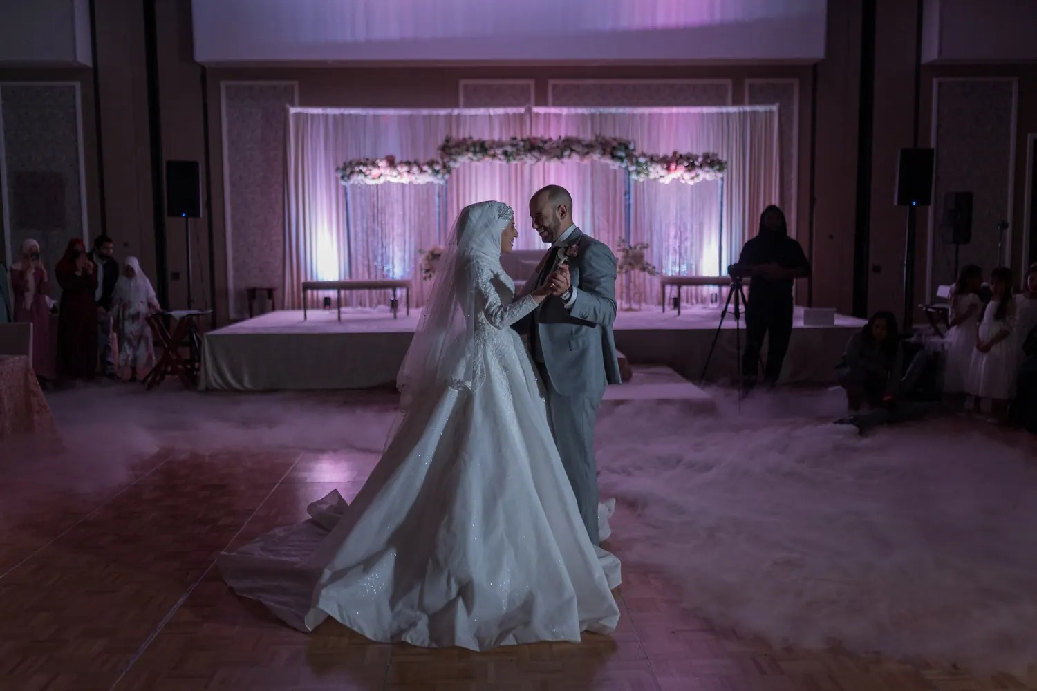 Desi couple sharing their first dance at their wedding reception, photographed by Weddings Unlimited