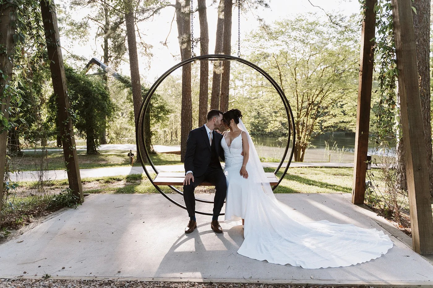 Bride and groom at the circular metal wedding arch at Forever 5 Events, Conroe, TX