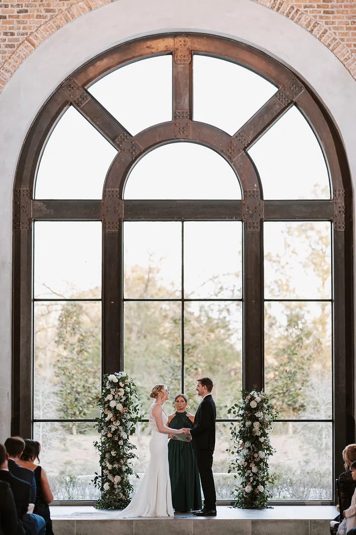 Arched glass windows inside the venue at Iron Manor by Walters Wedding Estates, Texas