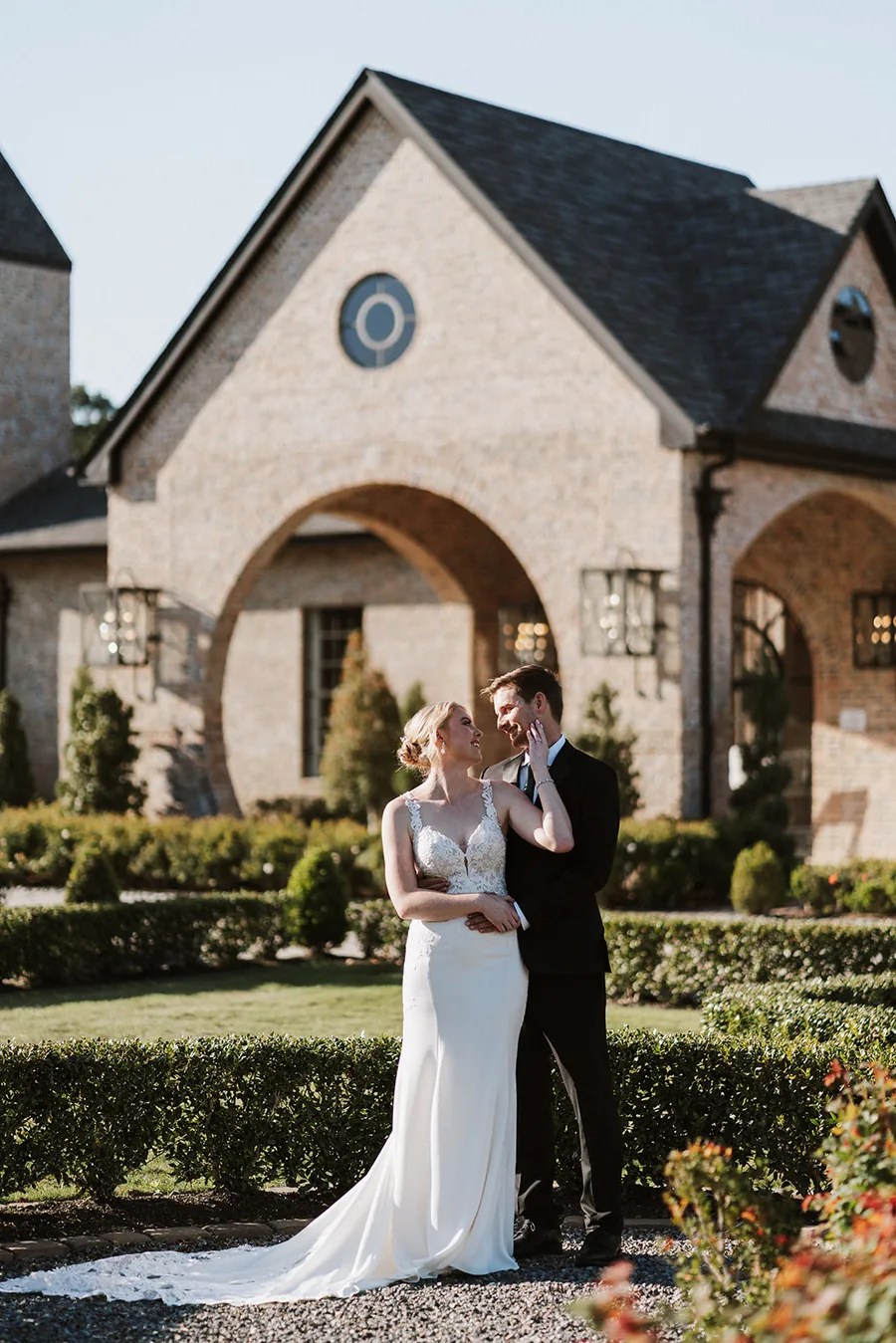 Bride and groom in a close embrace at Iron Manor by Walters Wedding Estates, Texas