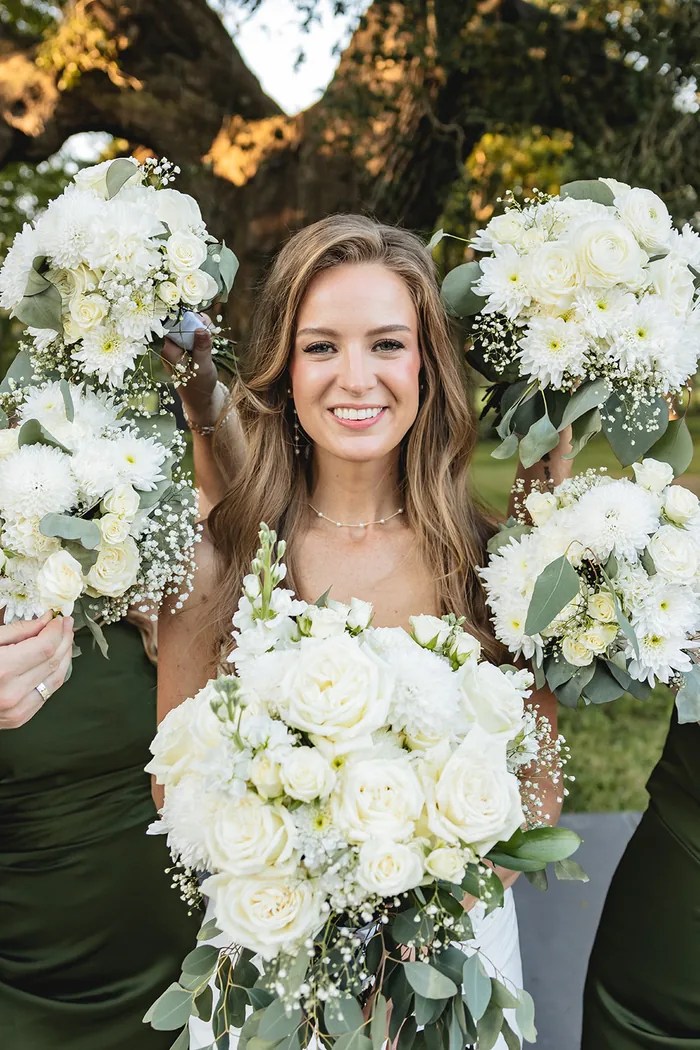 Bride holding her white rose bouquet at The Oaks at Oak Plantation, Texas
