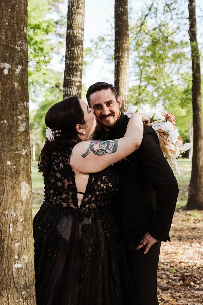 Bride and groom close embrace outdoors at The Reserve on Cypress Creek, Cypress, TX