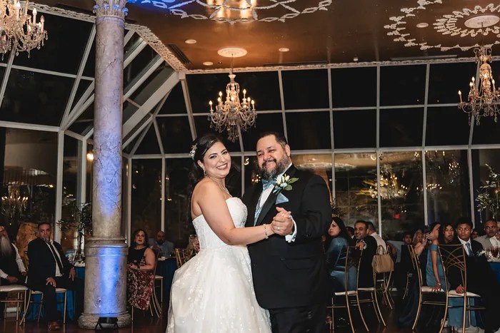 Bride and groom celebrating with entertainer at Old San Francisco Steak House, Houston, TX