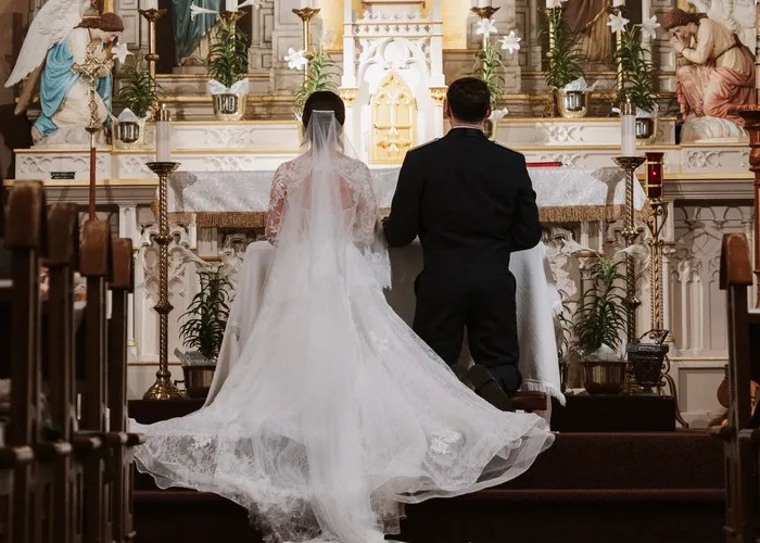 Candid wedding moment at St. Joseph Catholic Church, Waxahachie, TX