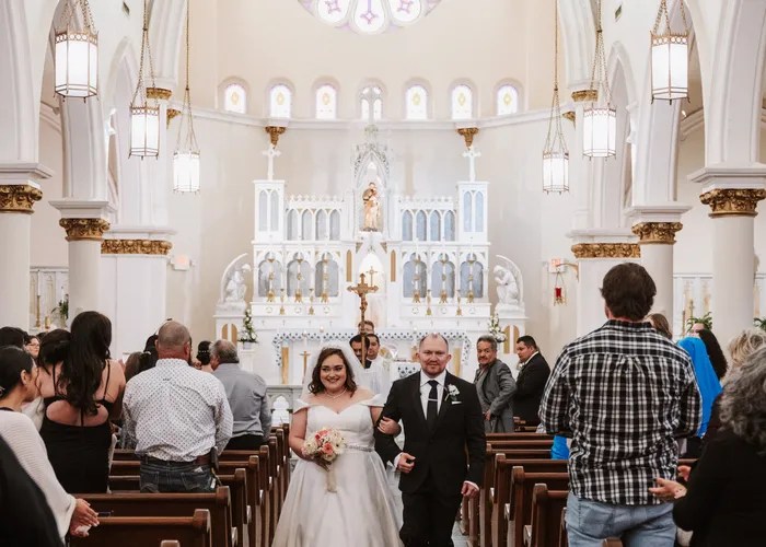 Candid wedding moment at St Joseph Catholic Church, Houston, TX