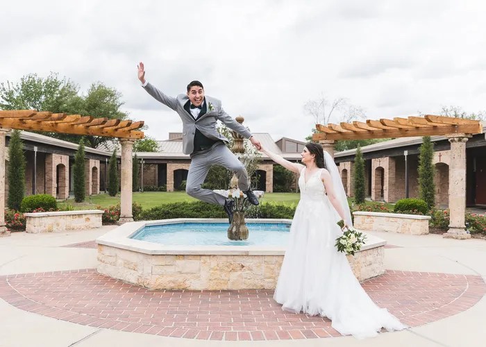 Candid wedding moment at St. Laurence Catholic Church, Sugar Land, TX