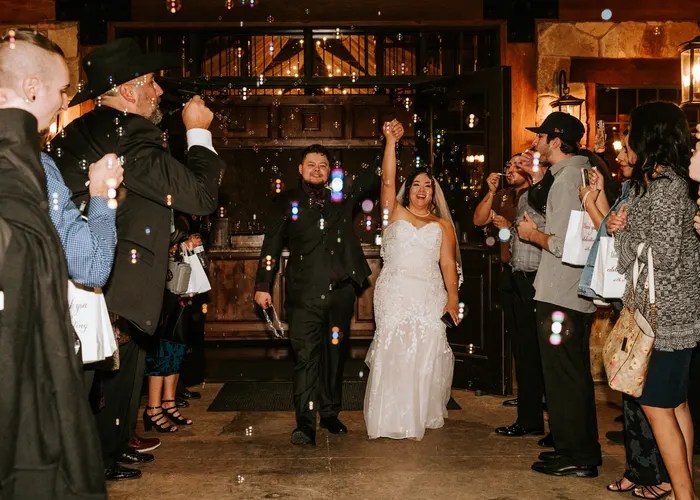 Candid wedding moment at Walden Retreats Hill Country, Johnson City, TX