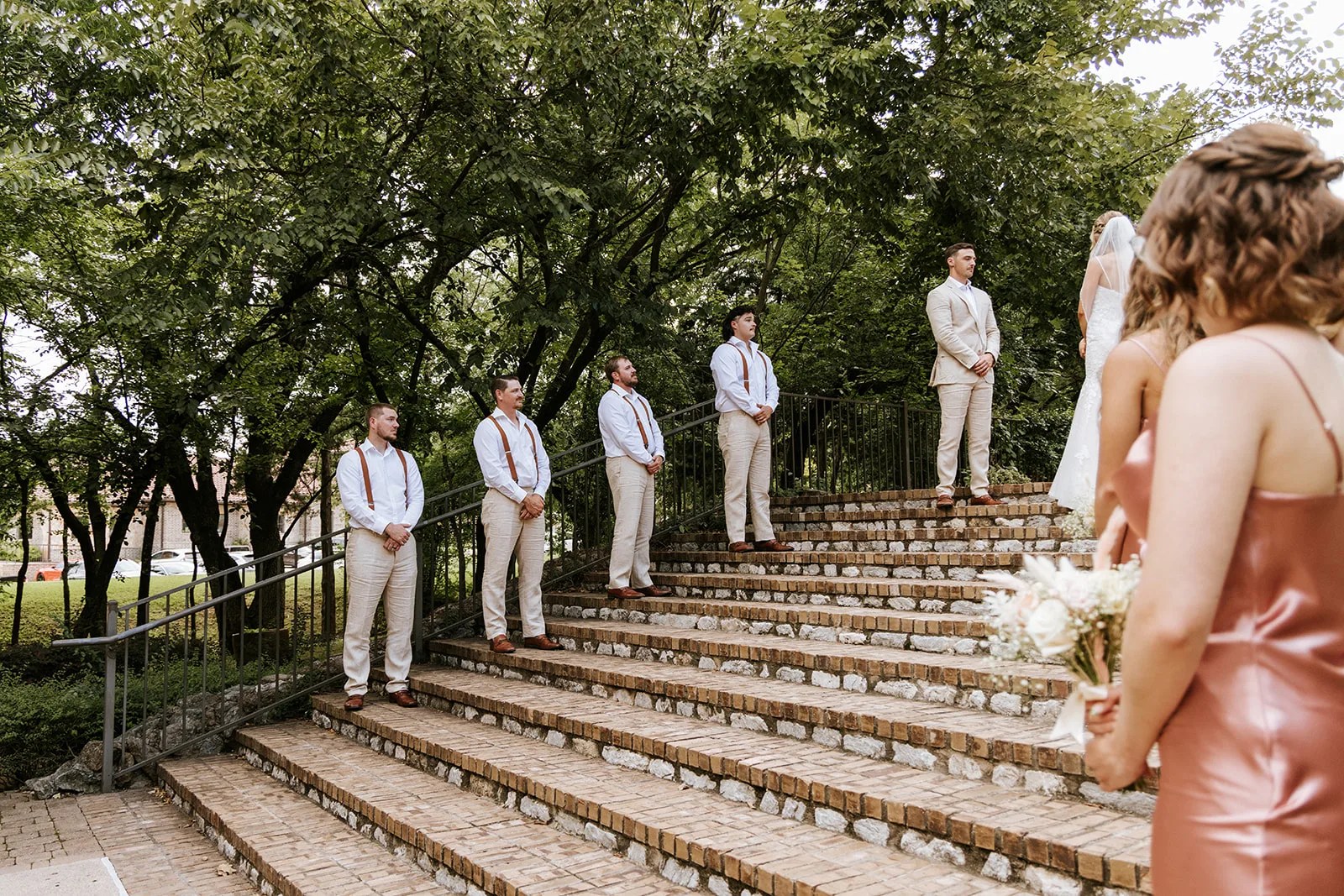 Bride on the grand staircase at Aristide Mansfield in Mansfield, TX