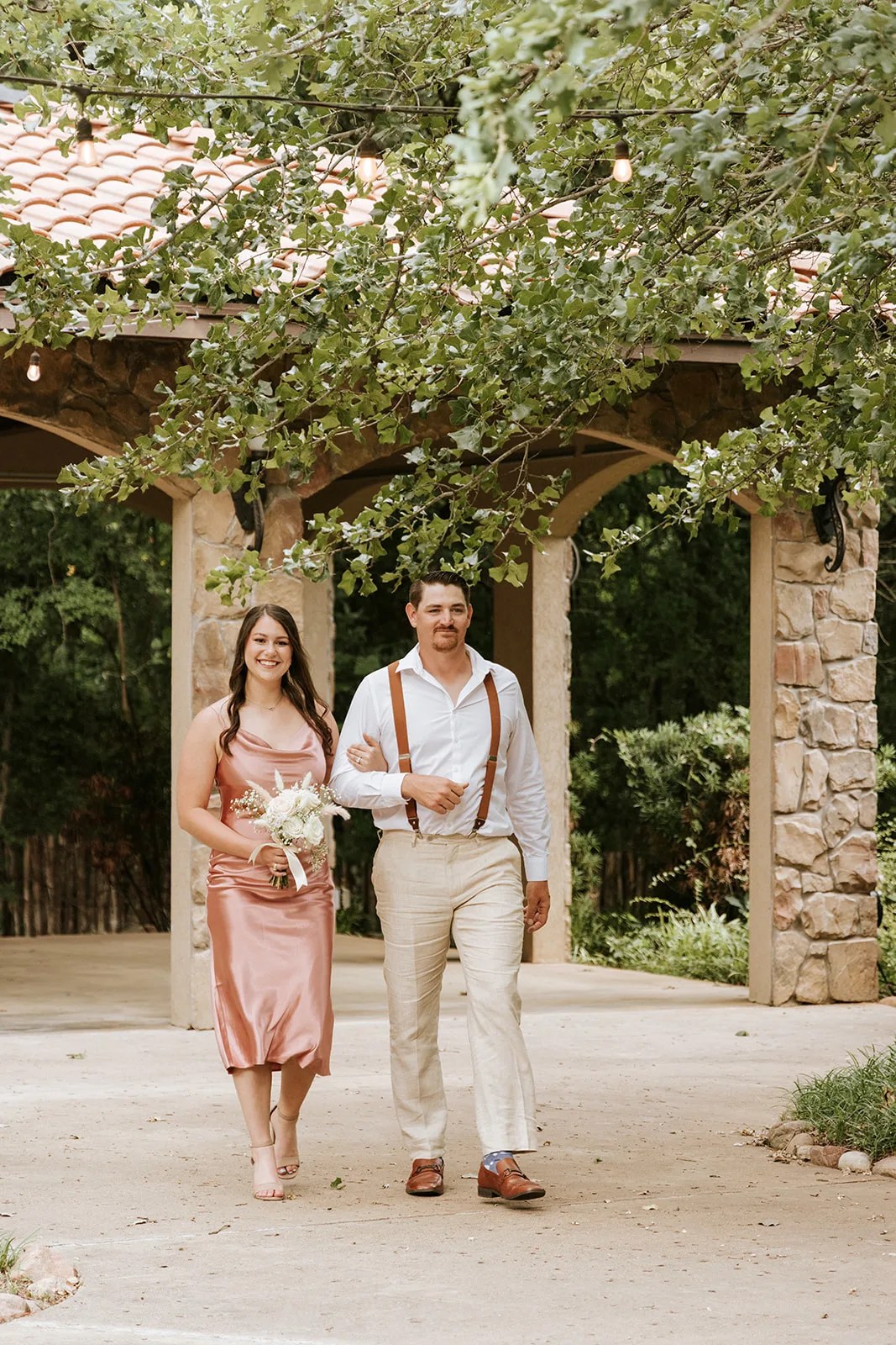 Ceremony at the ivy covered loggia at Aristide Mansfield in Mansfield, TX