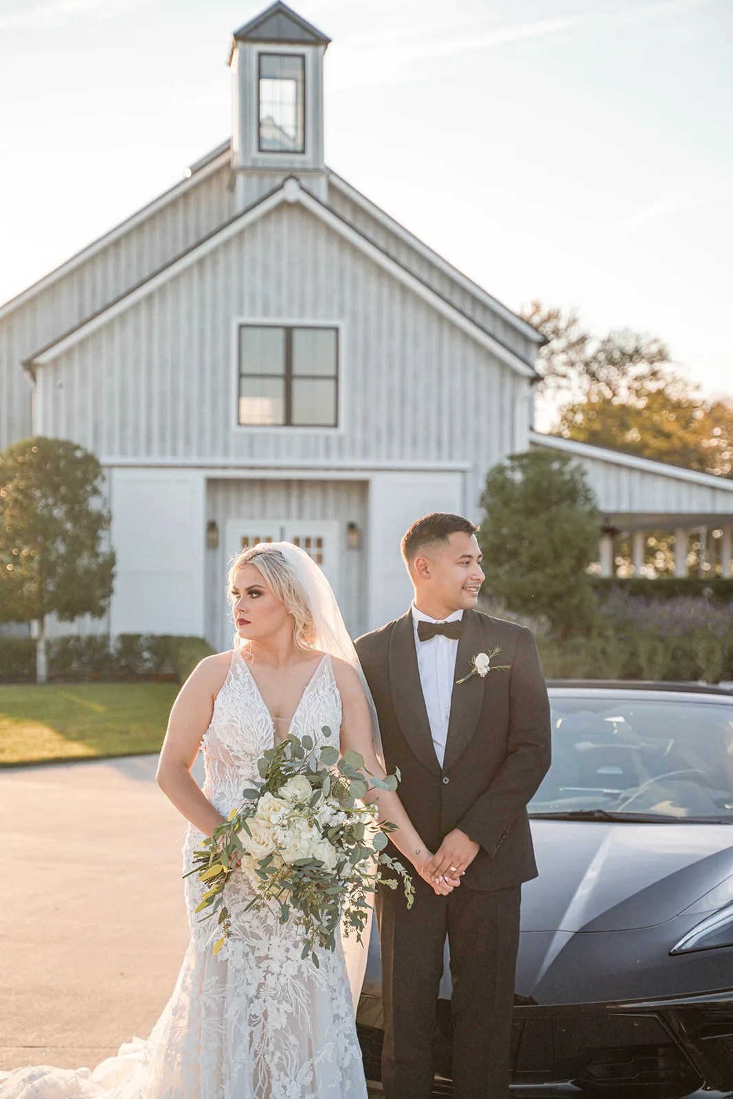 Couple outside the white barn at Arrowhead Hill, Montgomery, TX