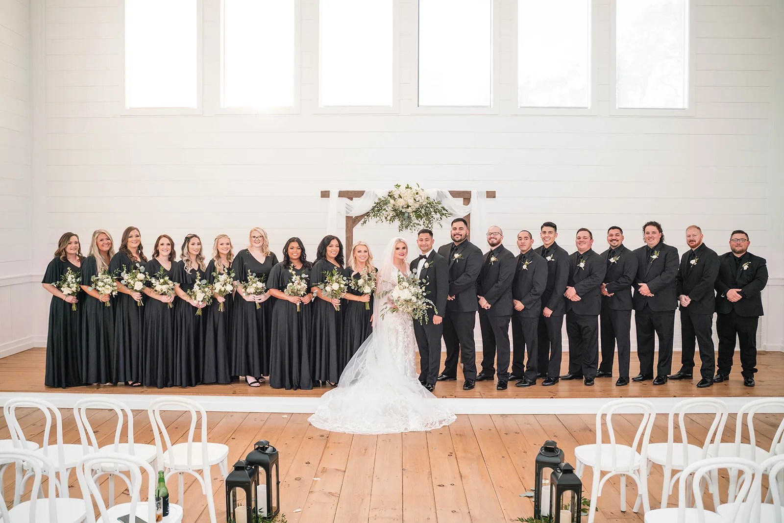 Bridesmaids across the chapel front at Arrowhead Hill, Montgomery, TX
