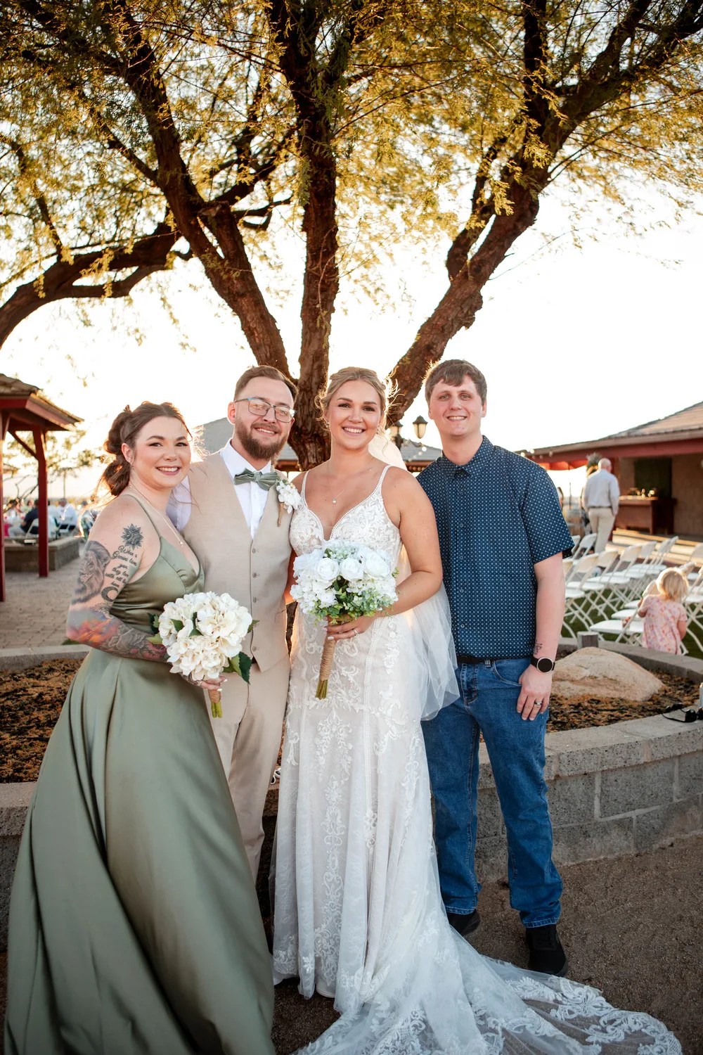Wedding party under the trees at Ashley's Backyard