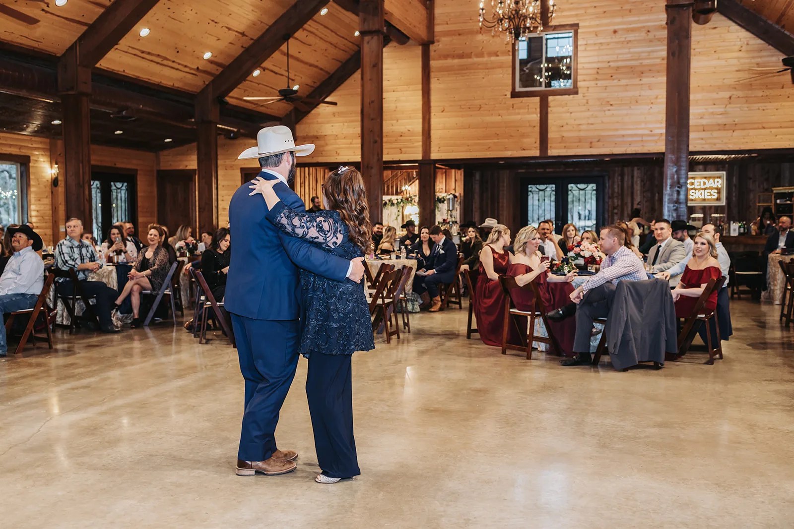Guests dancing in the barn at Cedar Skies in Burnet, TX
