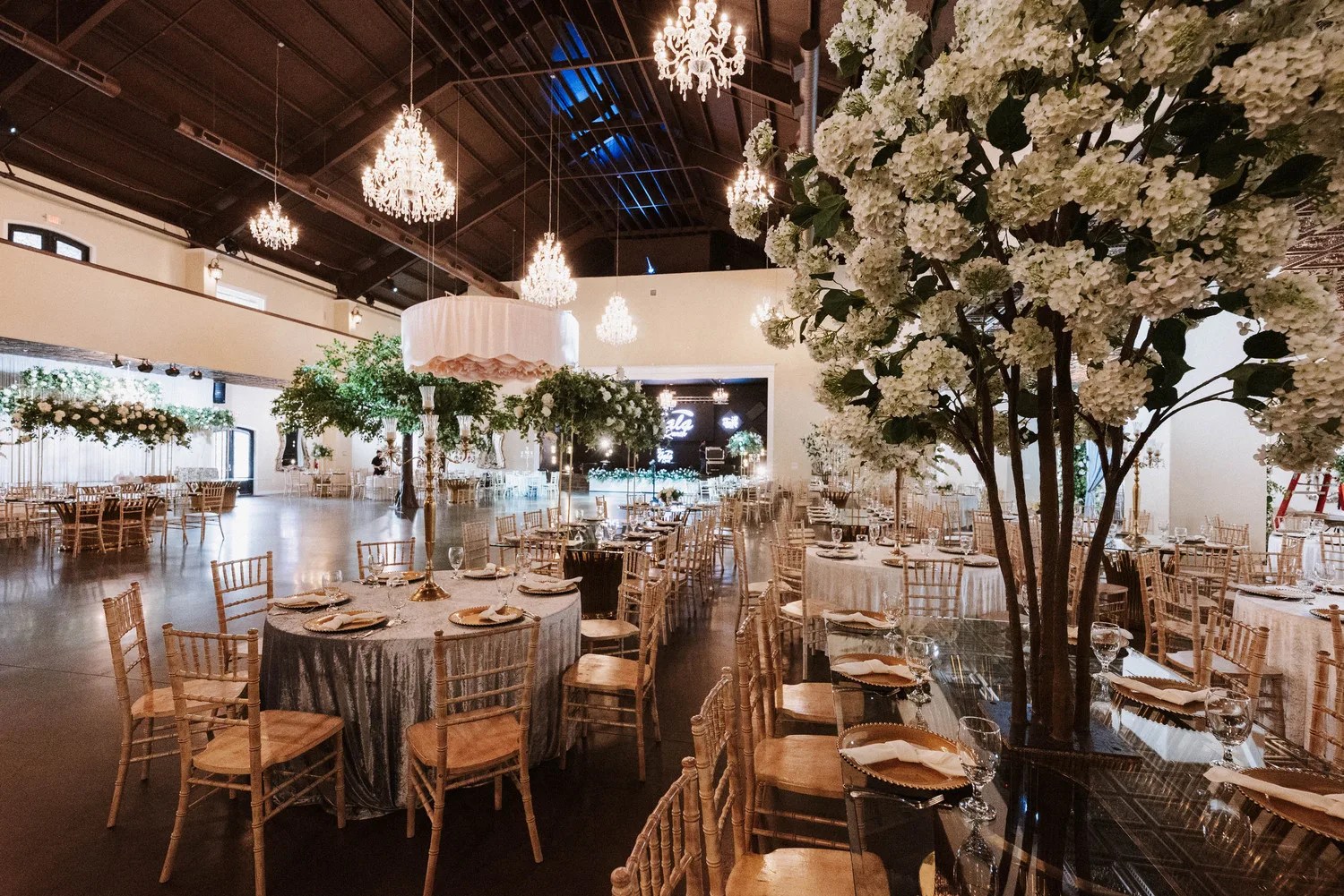Reception hall under chandeliers at D'Gala Ranch, Crosby, TX