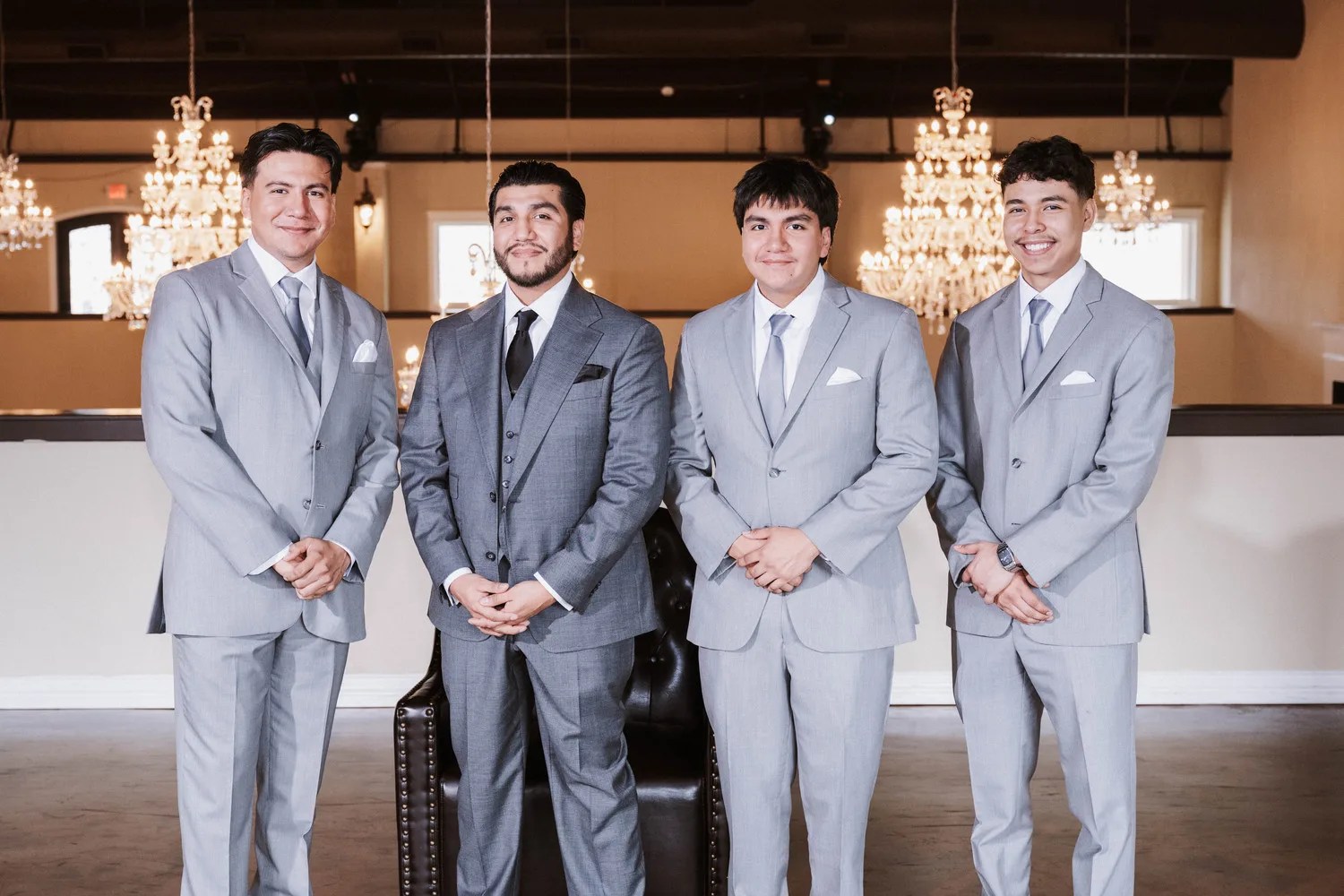 Groomsmen in the chandelier hall at D'Gala Ranch, Crosby, TX