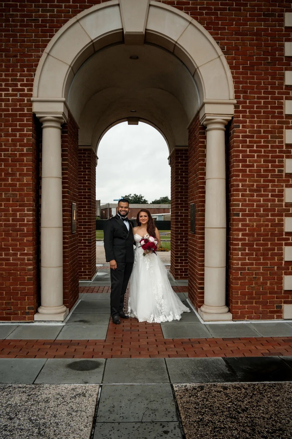 Couple in the brick archway at Eden Events, Houston, TX