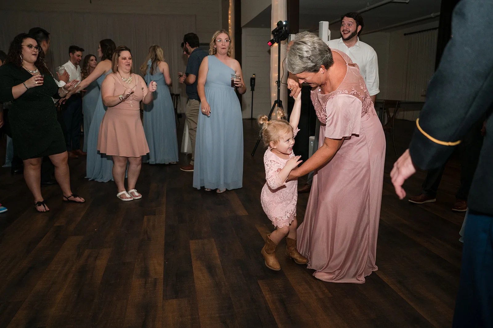 Reception under the wooden trusses at HighPointe Estate in Liberty Hill, TX