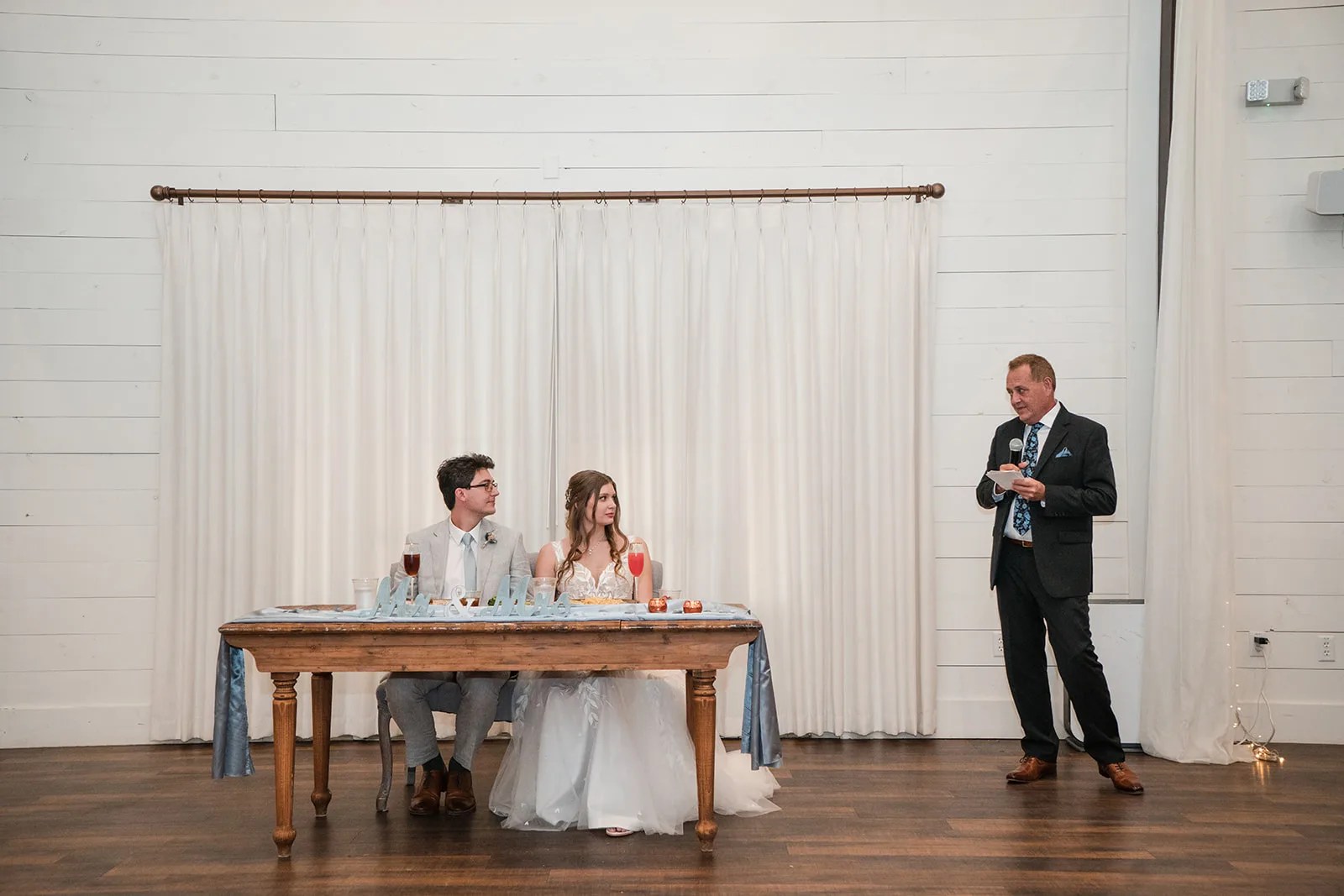 Sweetheart table in the ballroom at HighPointe Estate in Liberty Hill, TX