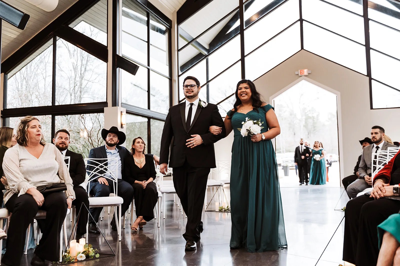 Wedding processional in the glass chapel at Jennings Trace in Montgomery, TX