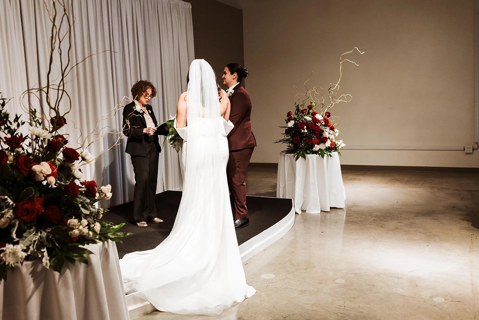 Bride in the draped event space at Level Two Events in Dallas, TX