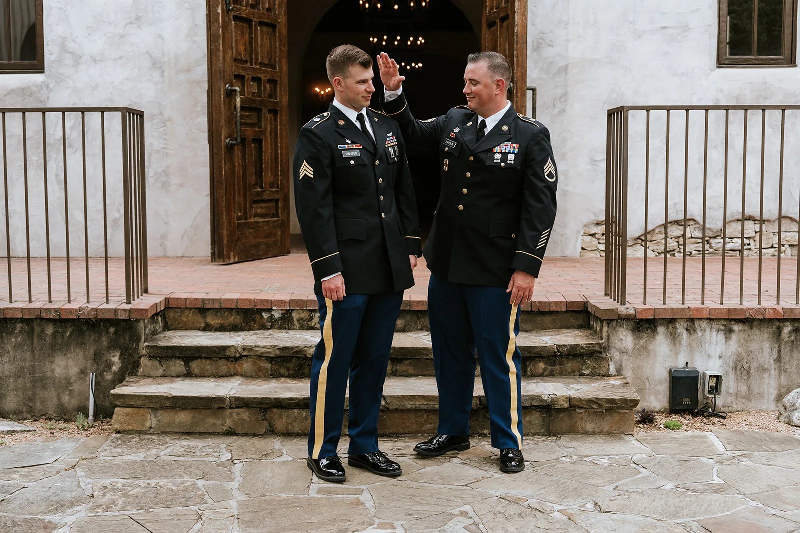 Wedding party on the stone steps at Lost Mission in Spring Branch, TX