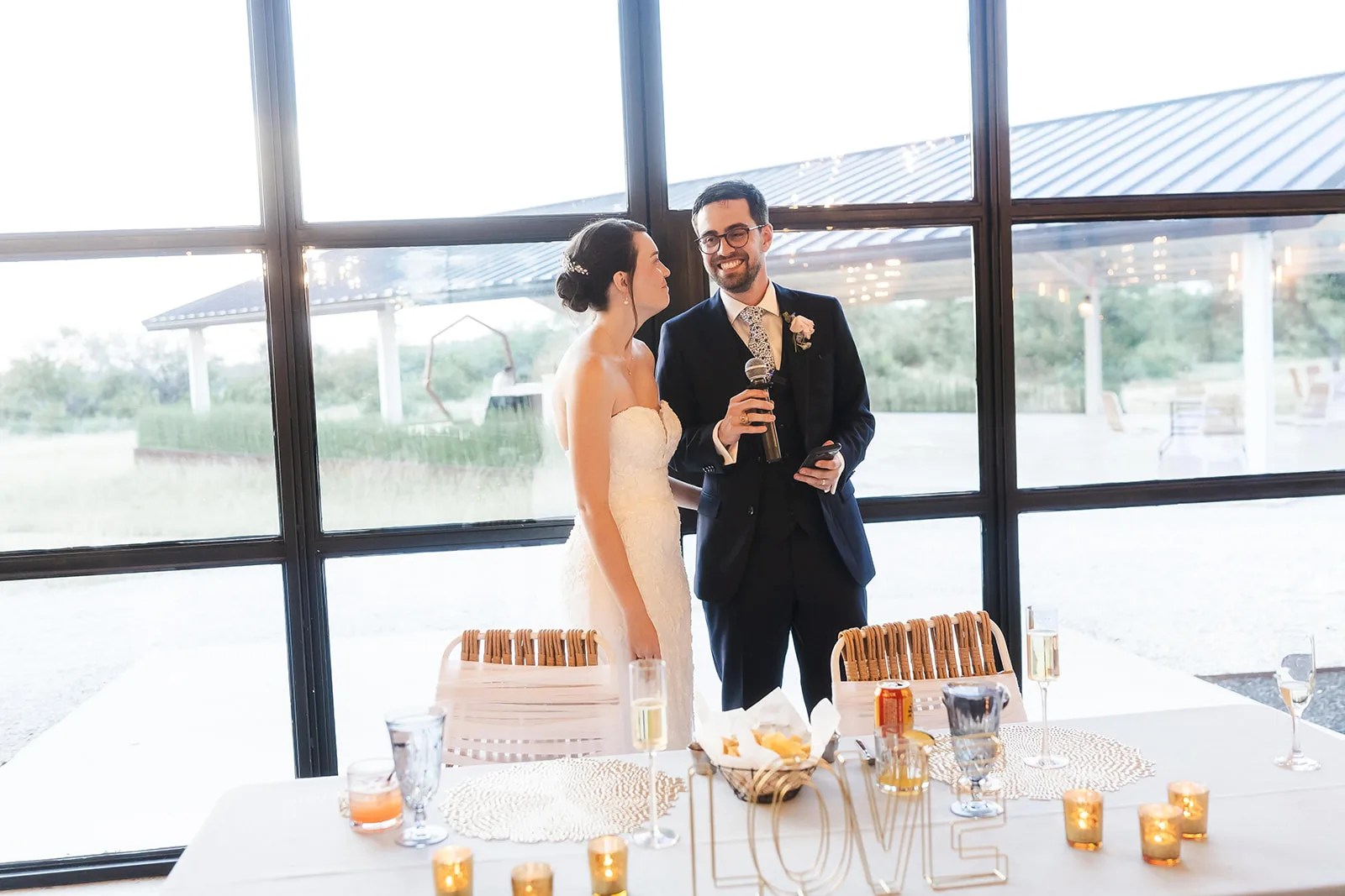 Reception interior with glass walls at Mae's Ridge at Mae's Ridge, Johnson City, TX