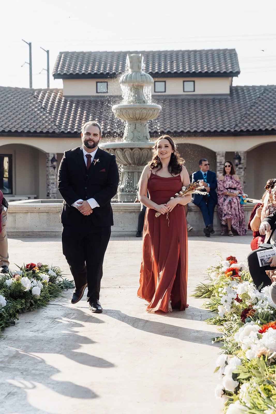 Courtyard ceremony aisle and tile roofline at Monarca Event Center Edinburg