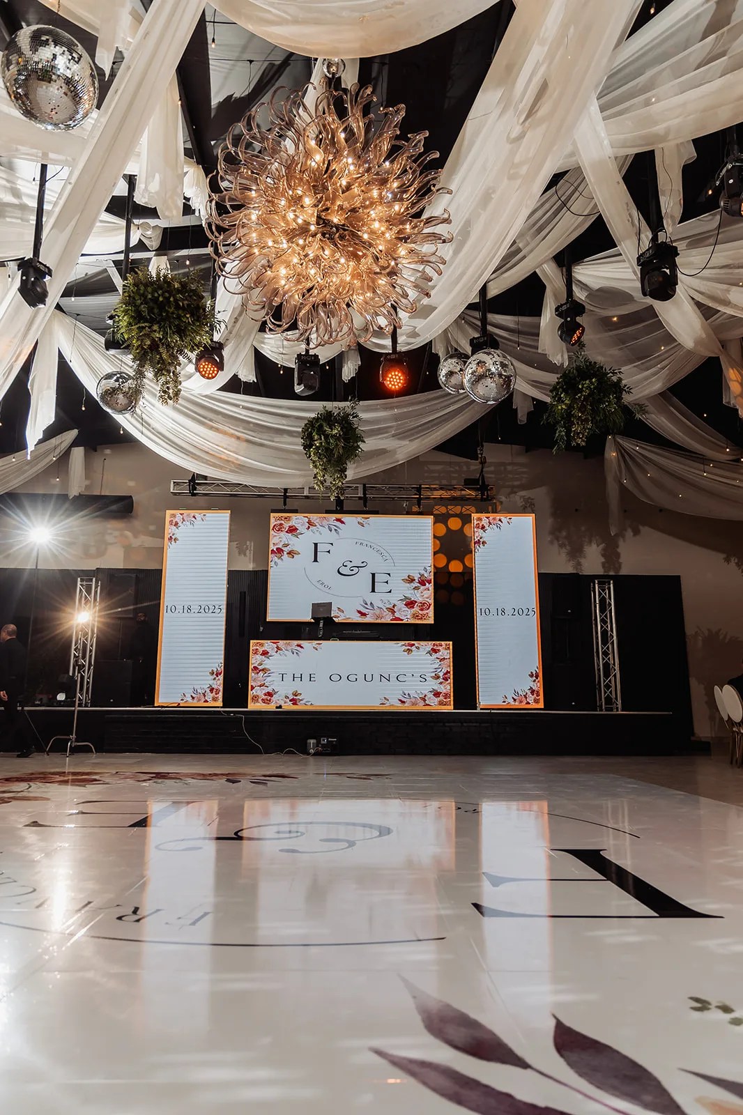 Ceiling drape and chandelier lighting at Monarca Event Center in Edinburg, Texas