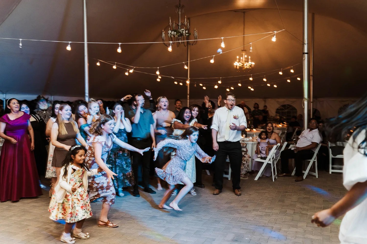 Dance floor under string lights at Nardini Manor