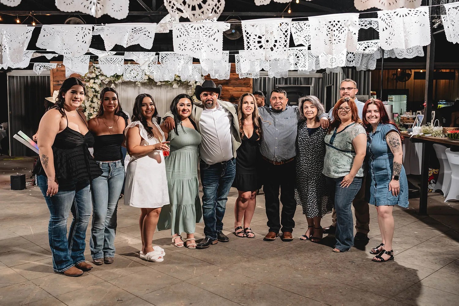 Reception under papel picado and string lights at Parque Estrada