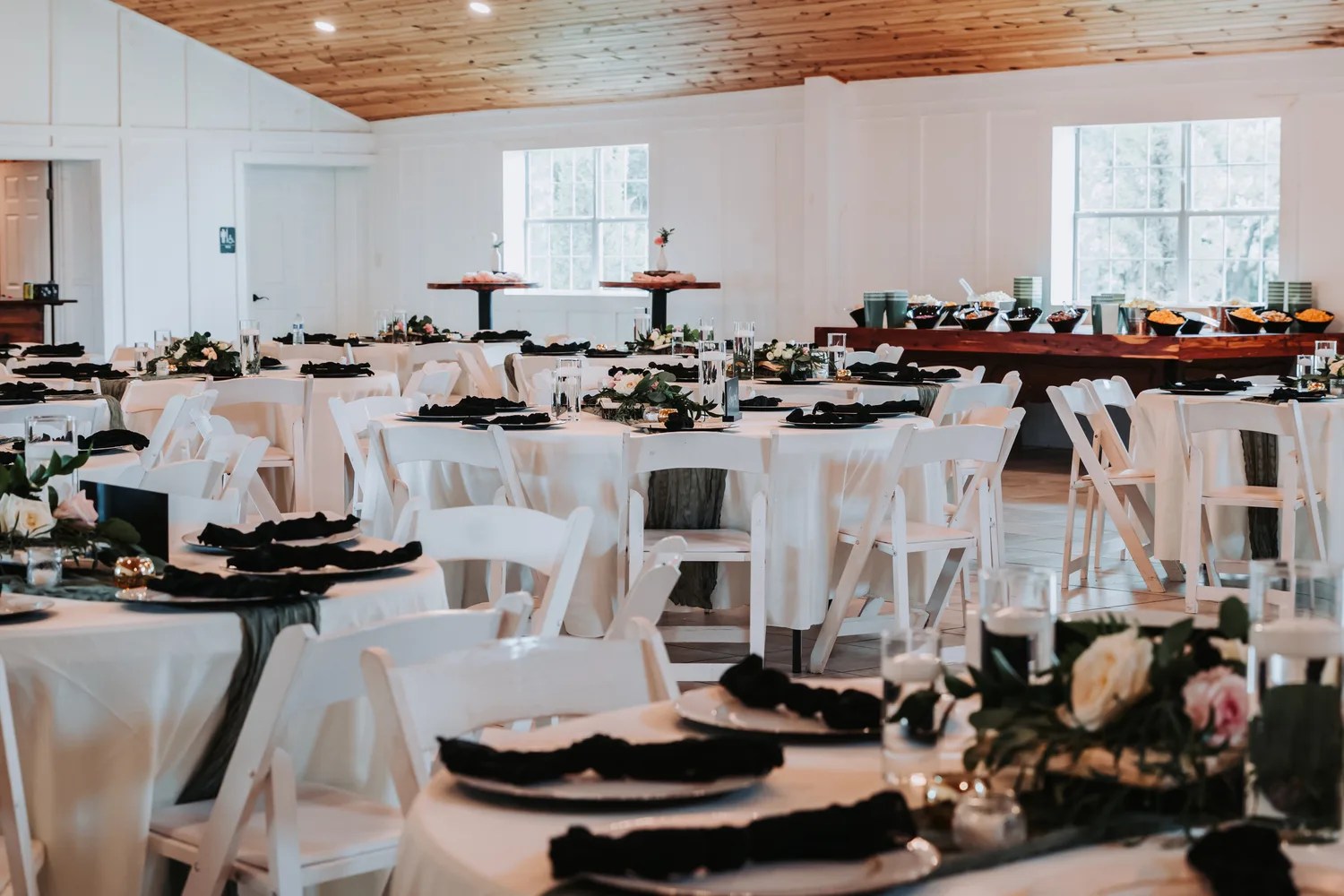 Ceremony aisle and timber arch at Peninsula Ranch in Quinlan, Texas