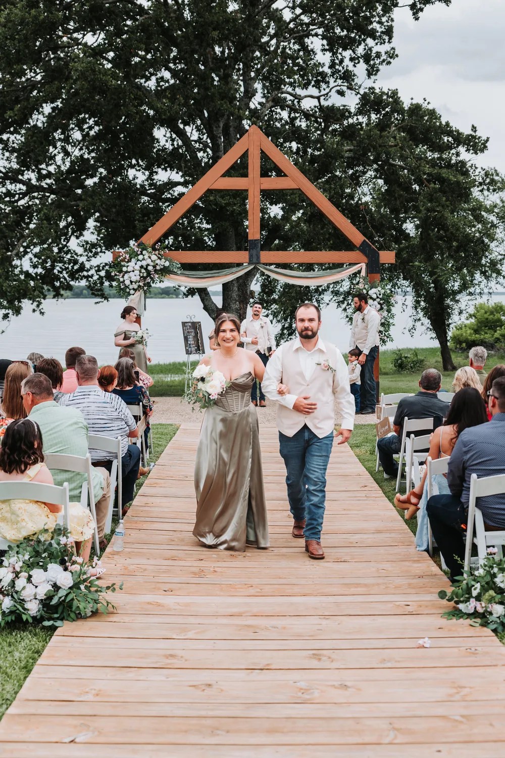 Guests seated for a lakeside ceremony at Peninsula Ranch