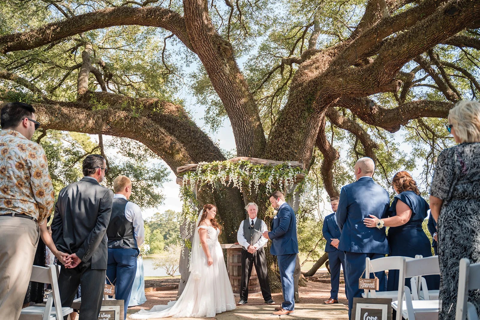 Ceremony aisle under the oaks at Pine Lake Ranch in Montgomery, TX