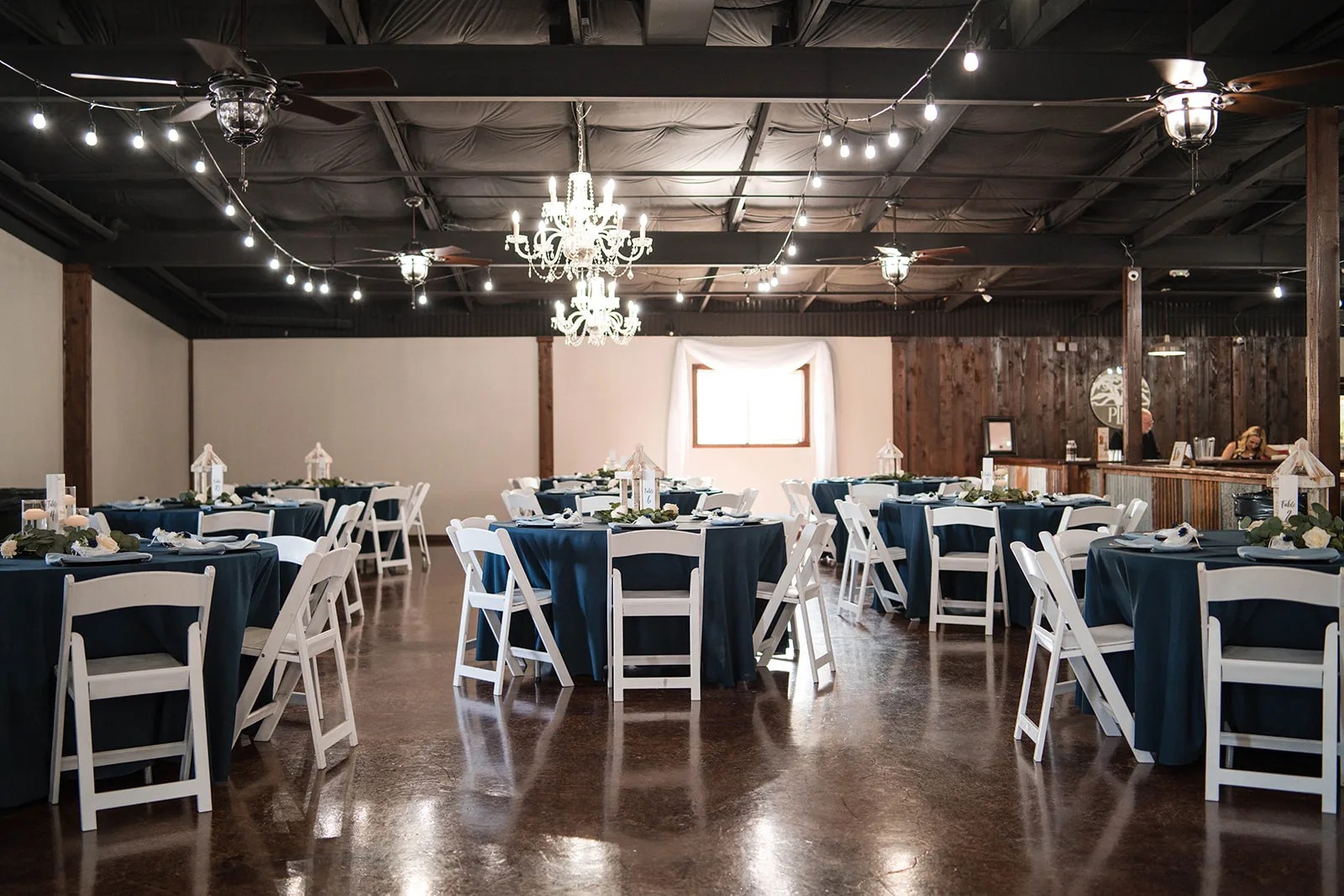Reception hall with string lights at Pine Lake Ranch in Montgomery, TX